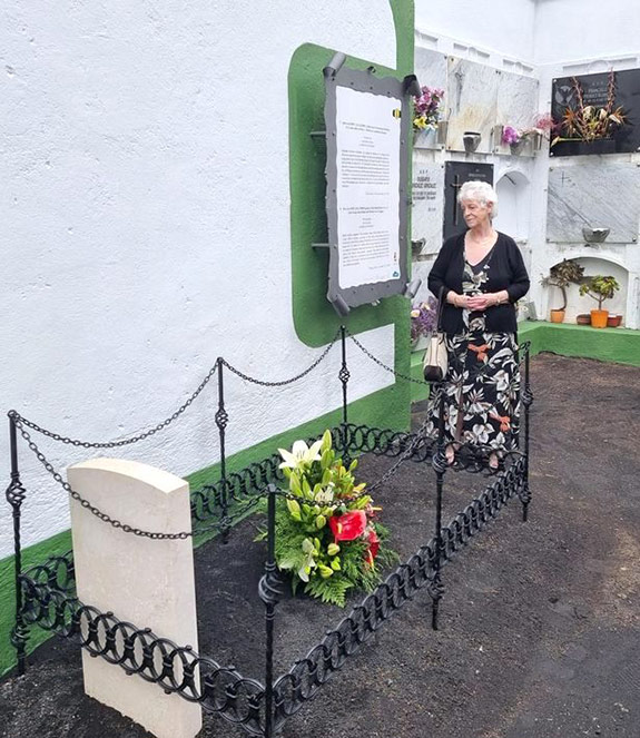 Mary Hastie stands at her uncle's grave